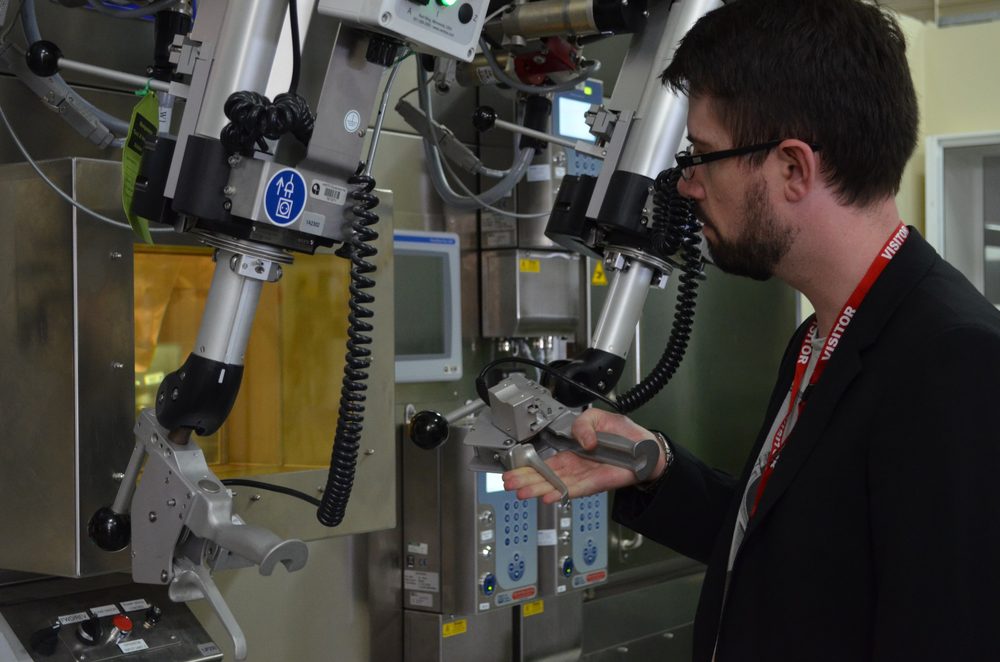 Anthony Fordham working a hot-cell manipulator at ANSTO